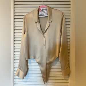 Wilfred gold blouse with tie in front of